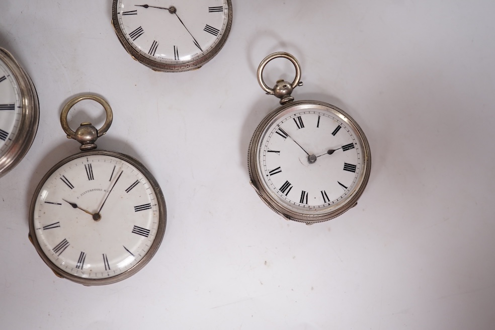 Three early to mid 20th century silver open faced pocket watches, with Roman or Arabic dials and subsidiary seconds, including two keyless and one key wind (Admiral Tacy Watch Co), together with one smaller silver open f